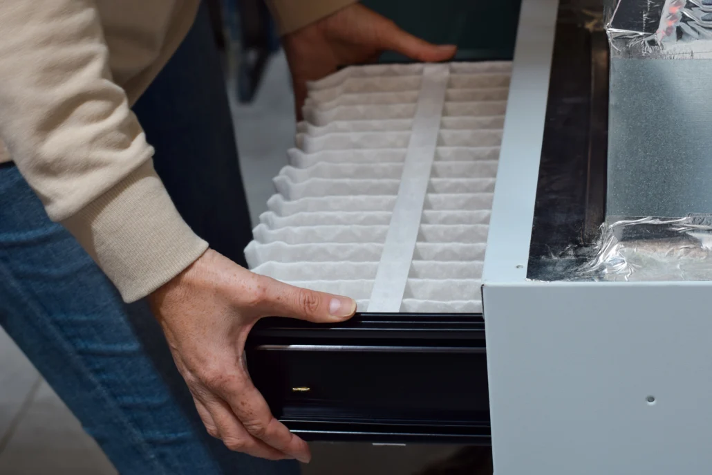 Heating Replacement In Stafford, TX 1 A professional technician replacing a Furnace filter
